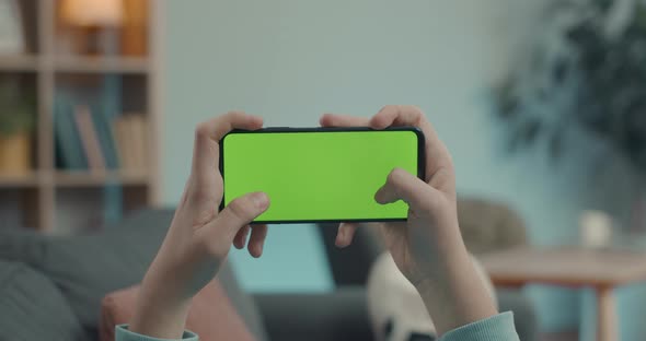 Male Person Texting on Green Empty Screen of Mobile