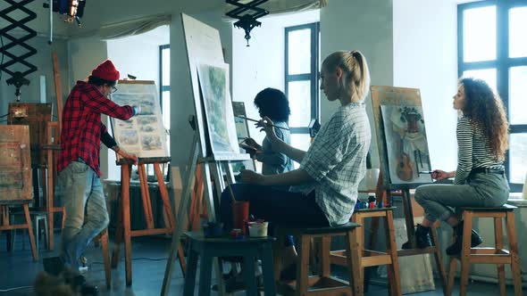 Group of Ladies are Studying Painting in the Art School