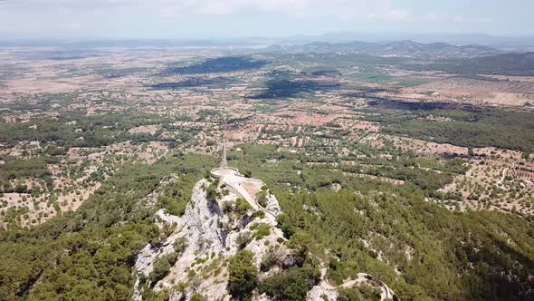 Aerial: The Holy Cross on the mountain of Saint Salvador in Mallorca, Spain