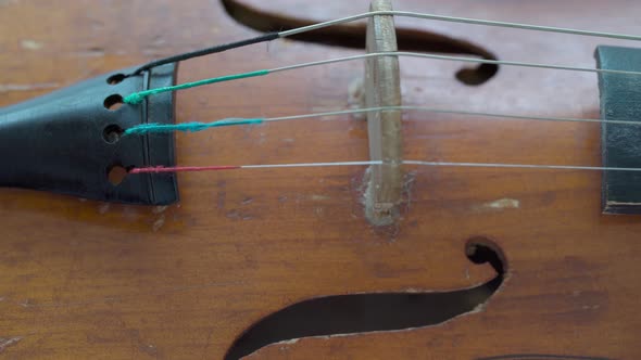 Antique Retro Classical Violin First Size on a Wooden Table