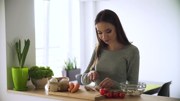Healthy Food. Woman Cooking Fresh Vegetable Salad At Kitchen