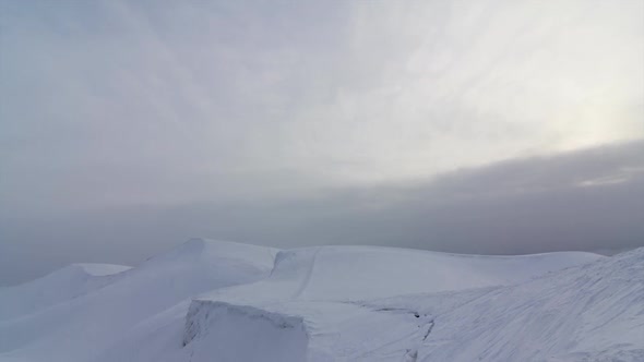 Time Lapse of Clouds Running on Blue Sky Over Amazing White Landscape of High Rocky Mountains and