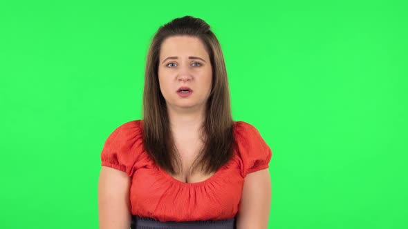 Portrait of Frightened Girl Says Wow with Shocked Facial Expression. Green Screen