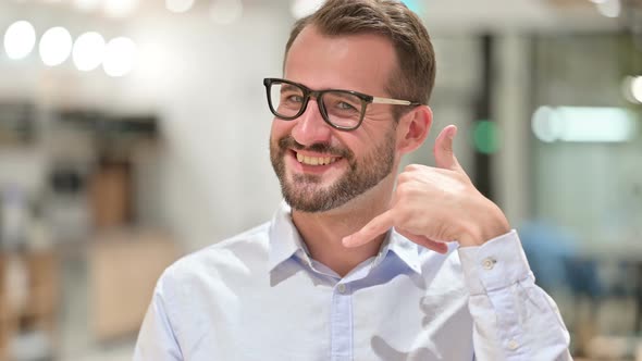 Portrait of Businessman Showing Heart Sign with Hand