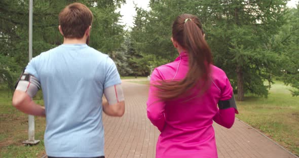 Couple Jogging in Park