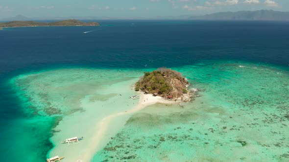 Small Torpic Island with a White Sandy Beach Top View