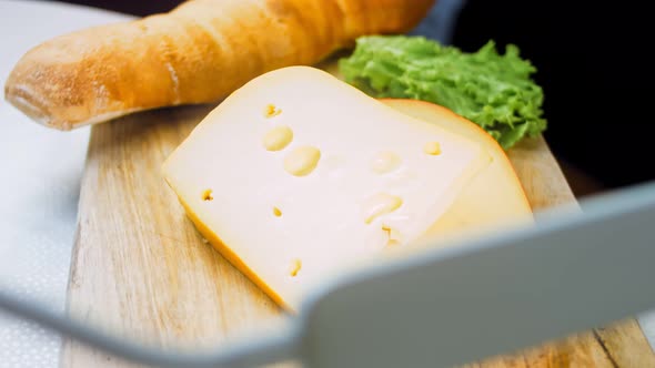 Cheese with Holes on a Retrostyle Cooking Tray