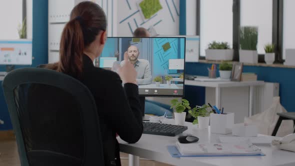 Businesswoman Using Video Call on Computer for Conversation