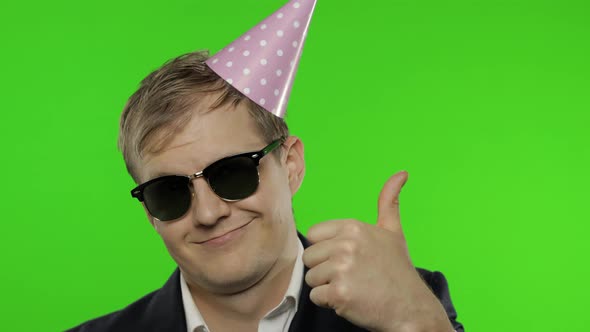 Drunk Sleepy Businessman in Festive Cap Wear Sunglasses Giving Thumbs Up