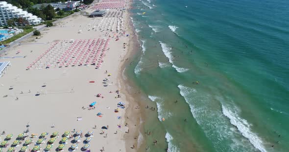 Aerial view of the beach and umbrellas in Albena, Bulgaria.