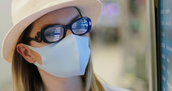 Close Up of Woman in COVID-19 Face Mask at Empty Airport. Safe Travels,  USA