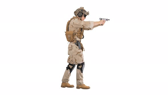 Special Operations Training Soldier Walking and Shooting From Hand Gun on White Background