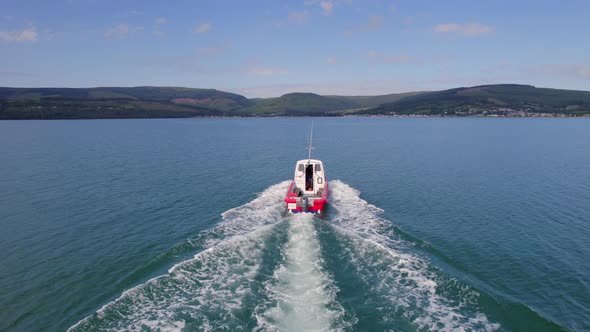 A Small Passenger Ferry Motoring Across the Sea in the Summer