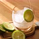 Man pouring soda into glass with ice and slice of lime. refreshing ice cold soda. - VideoHive Item for Sale