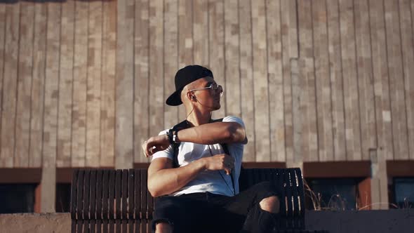 Young Man in Headphones in the City