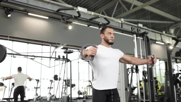 Professional Athlete Bodybuilder Working Out in an Indoor Gym