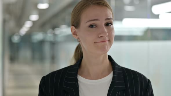 Portrait of Businesswoman Saying Yes By Shaking Head