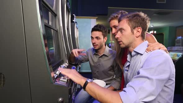 Group of Friend Playing with Slot Machines