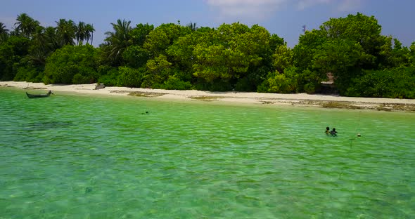 Wide angle fly over abstract view of a sunshine white sandy paradise beach and blue sea background