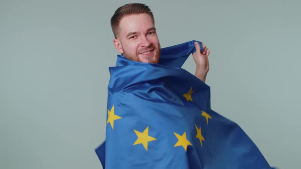 Man Waving European Union Flag Smiling Cheering Democratic Laws Human Rights Freedoms in Europe