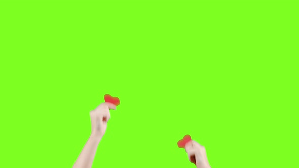 Female Blogger Hold in Hands Little Red Hearts on Green Screen