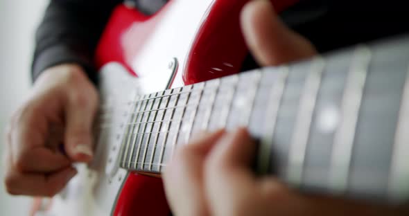 Musician Playing the Guitar During a Live Performance