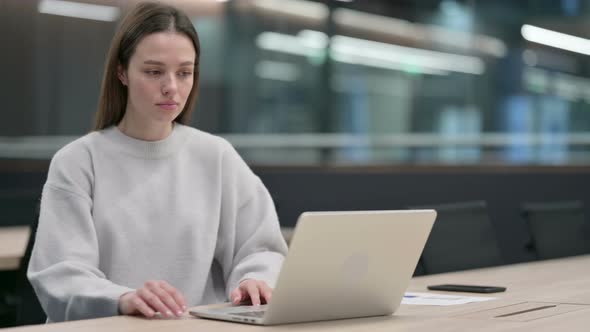 Woman Leaving Laptop Standing up Going Away