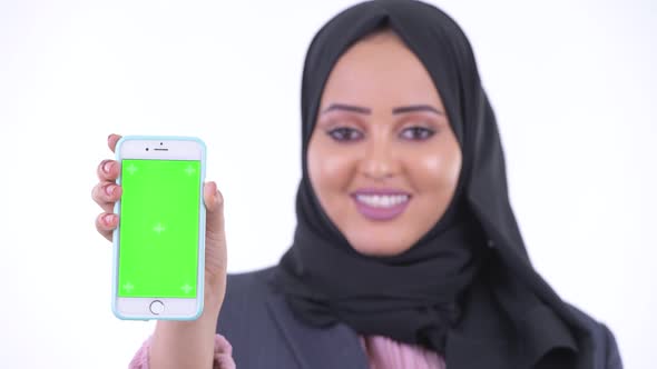 Face of Happy Young African Muslim Businesswoman Showing Phone