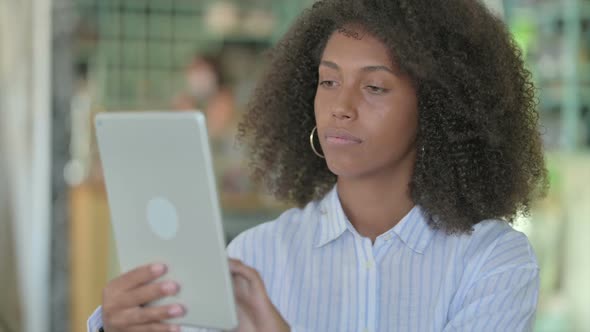 Portrait of African Businesswoman Using Digital Tablet