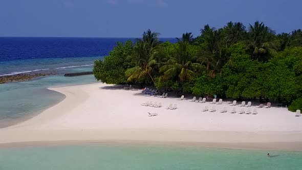 Aerial drone landscape of coastline beach trip by blue water and sand background