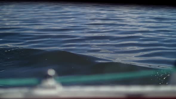 Waves of Water Removed From the Porthole of the Yacht