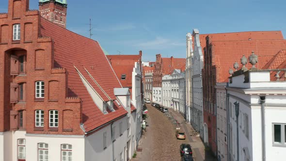 Forwards Fly Through Historic Curved Street in Medieval City Centre