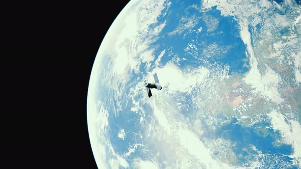 Telescope in Outer Space Near Surface of Blue Planet alt