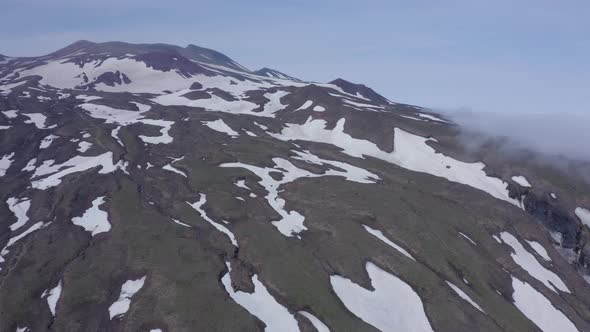 Aerial Footage of the Gorely Volcano Peaks Rising Above the Fog