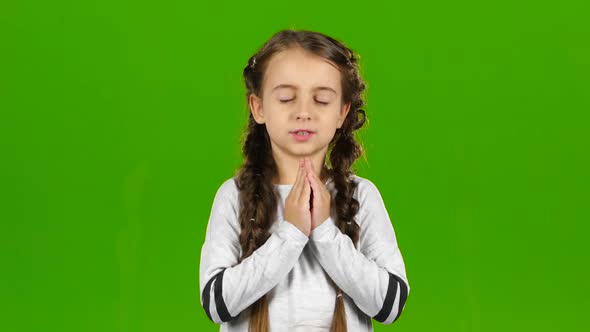 Child Crosses His Fingers in His Arms. Green Screen