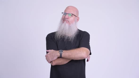 Mature Bald Bearded Man Looking Bored and Frustrated