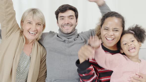 happiness caucasian and latin family dad mother  grandmom and girls waving goodbye together