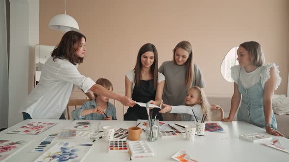 Happy Mother and Daughter Enjoying at Drawing Class