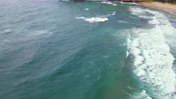 High and powerful waves coming fast to the beach, waves in winter day