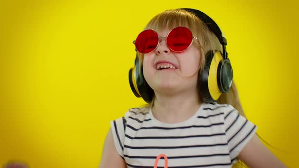 Young Blonde Teen Kid Child Girl Listening Music Via Headphones Dancing Disco Fooling Having Fun