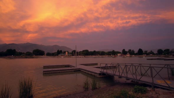 View of colorful sunset glowing over boat dock