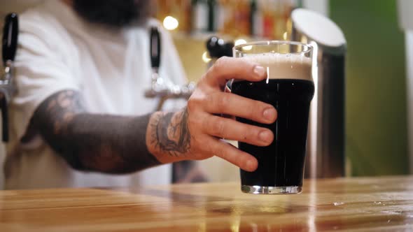 Foamy Stout Beer in Glass Closeup