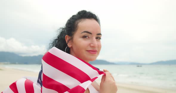 Patriotism Independence Day and Holidays Concept Happy Smiling Young Woman in Swimsuit with National