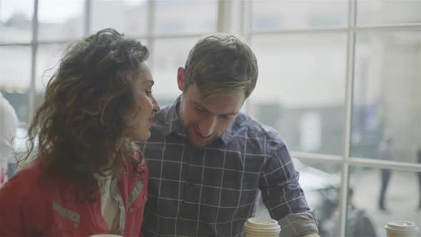 Couple hanging out in coffee shop