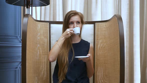 Smiling Beautiful Woman Sitting in Cafe Drinking Cup of Coffee and Relax