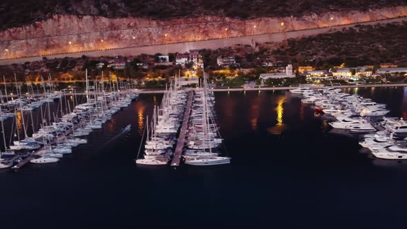 Privat Rich Yachts Moored on the Piers at Waterfront in Kas Town Turkey Filmed By Drone