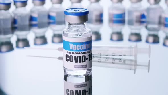 Glass vials for Covid-19 vaccine in laboratory. Group of Coronavirus vaccine bottles.