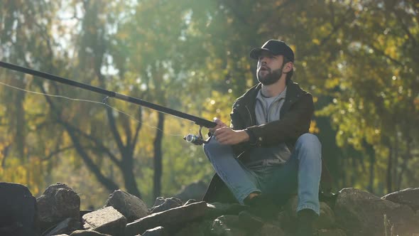 Excited Fisherman Spinning Fishing Reel