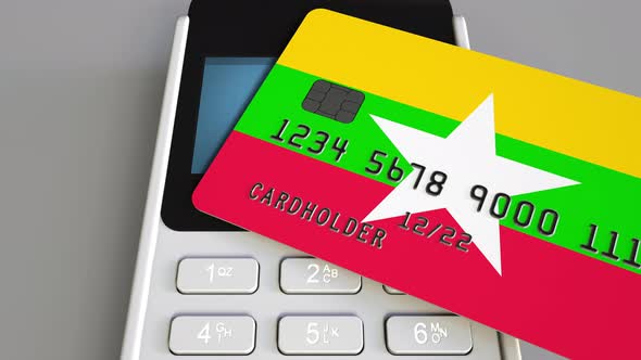Bank Card Featuring Flag of Myanmar and POS Terminal alt