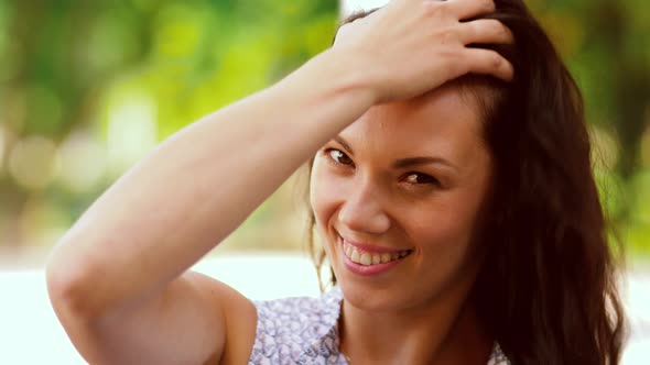 Portrait of Woman Touching Her Hair Outdoors 82